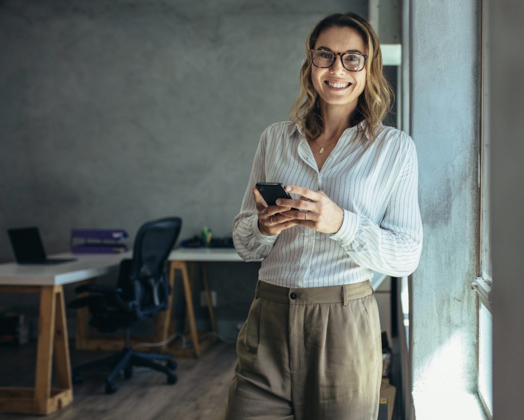 business woman using phone social media marketing