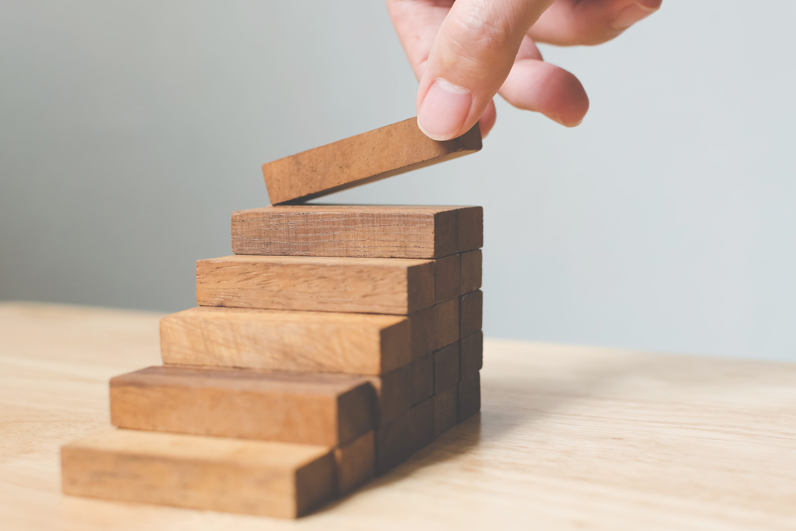 career progression marketing wooden blocks